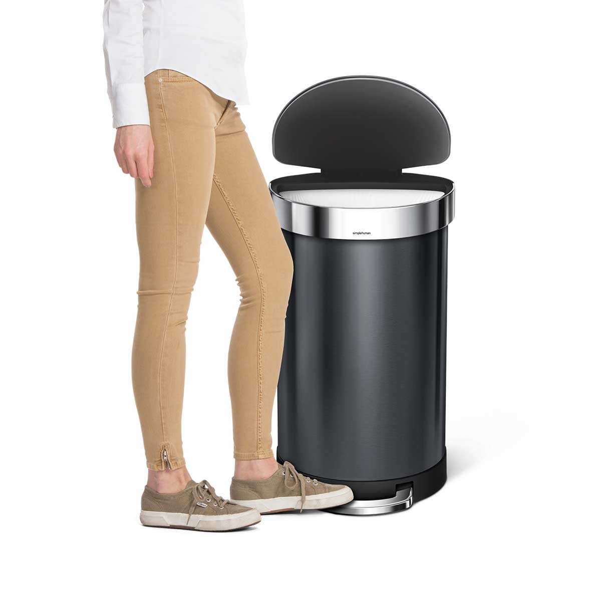Simplehuman 45L Semi-Round Step Can, Dark Bronze Stainless Steel, user operating hands-free pedal, demonstrating scale.