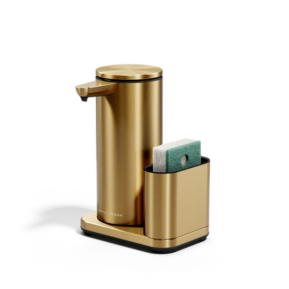 Angled view: Simplehuman Brass 14 oz Sensor Pump + Caddy holding a sponge, touch-free, rechargeable.